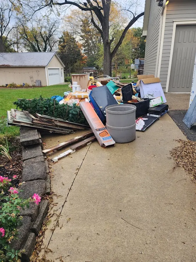 Dumpster being loaded with debris for 30 Yard Dumpster Rental in Westwood